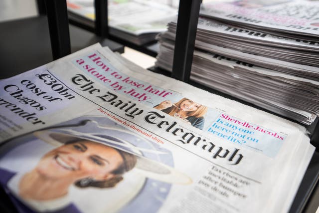 Copies of the Daily Telegraph newspaper on sale at a shop in Victoria, central London (PA/James Manning)
