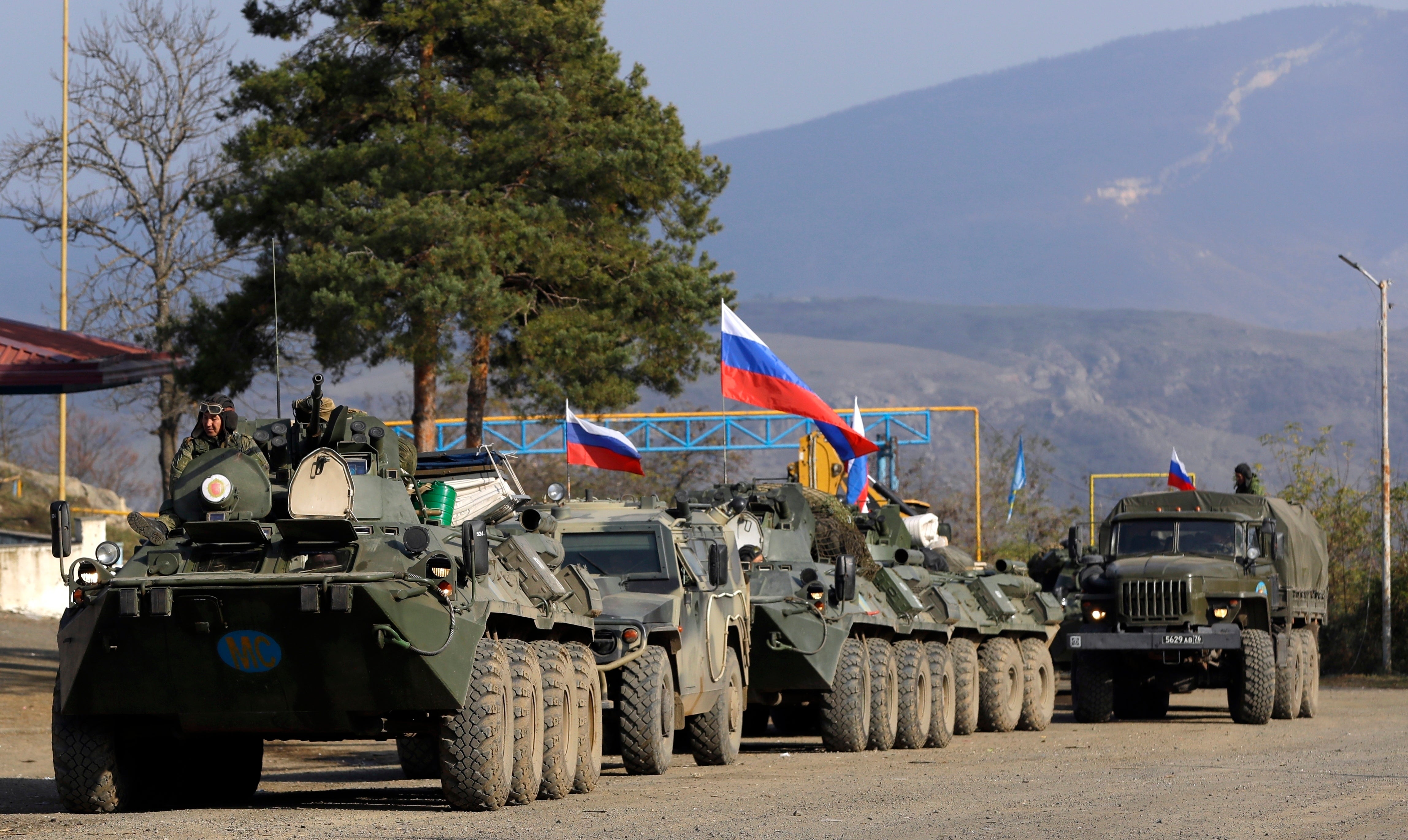 <p>Vehicles used by Russian peacekeepers are seen parked at a checkpoint on the road in the region of Karabakh in the South Caucasus, Nov. 17, 2020. (AP Photo/Sergei Grits, File)</p>