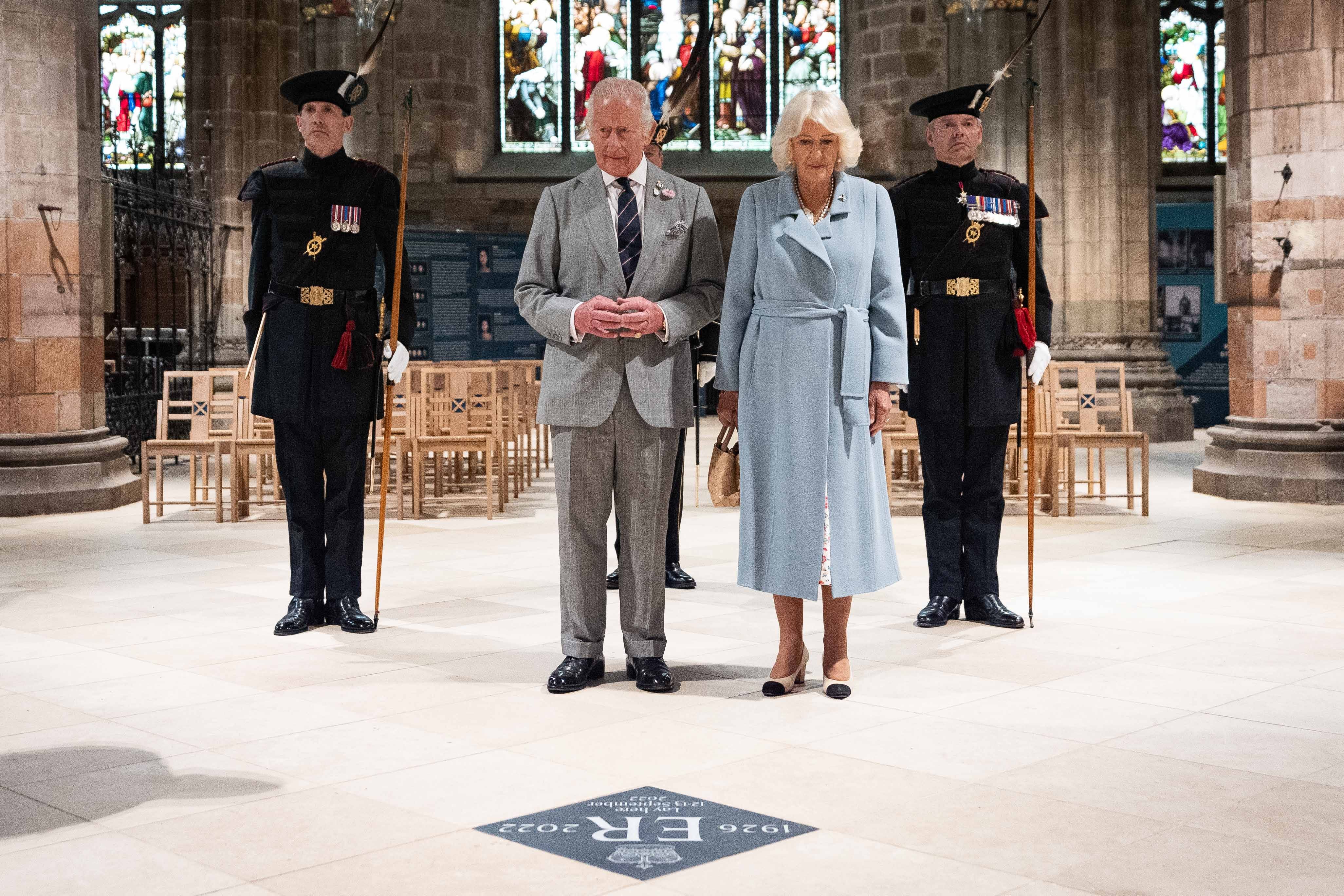 Charles and Camilla observed a moment’s silence at the unveiling of a memorial stone to Queen Elizabeth II at St Giles’ Cathedral in Edinburgh (Aaron Chown/PA)