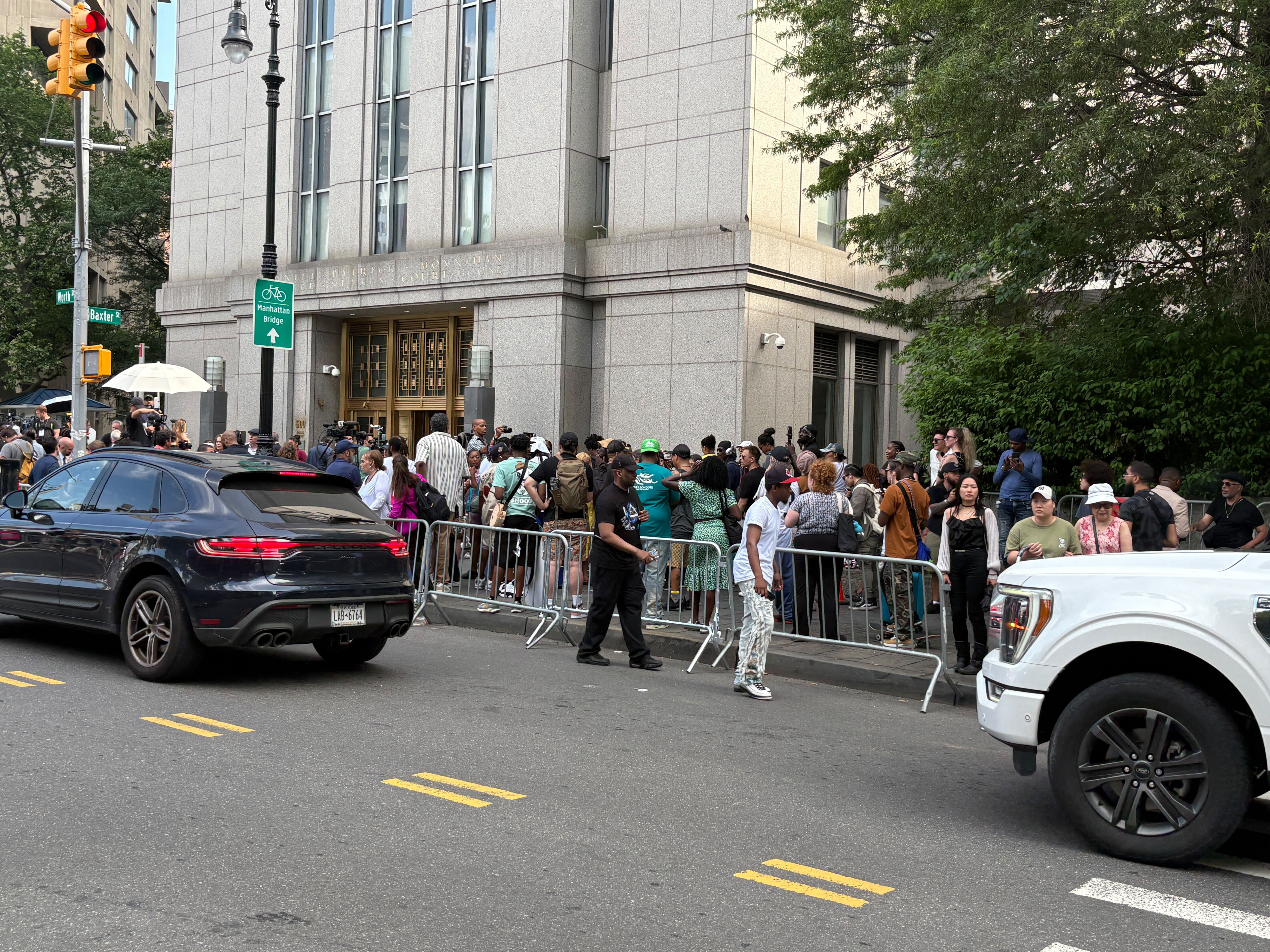 People gather outside the courthouse in New York as Sean “Diddy” Combs learns the verdict inside