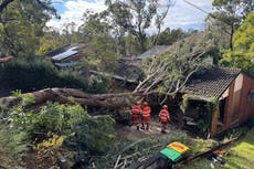 Thousands of Australians without power and flash flood warnings in place after ‘bomb cyclone’