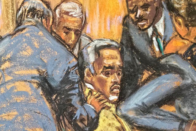 <p>Defense lawyers comfort Sean 'Diddy' Combs while discussing how to handle a note sent by jurors on Tuesday </p>