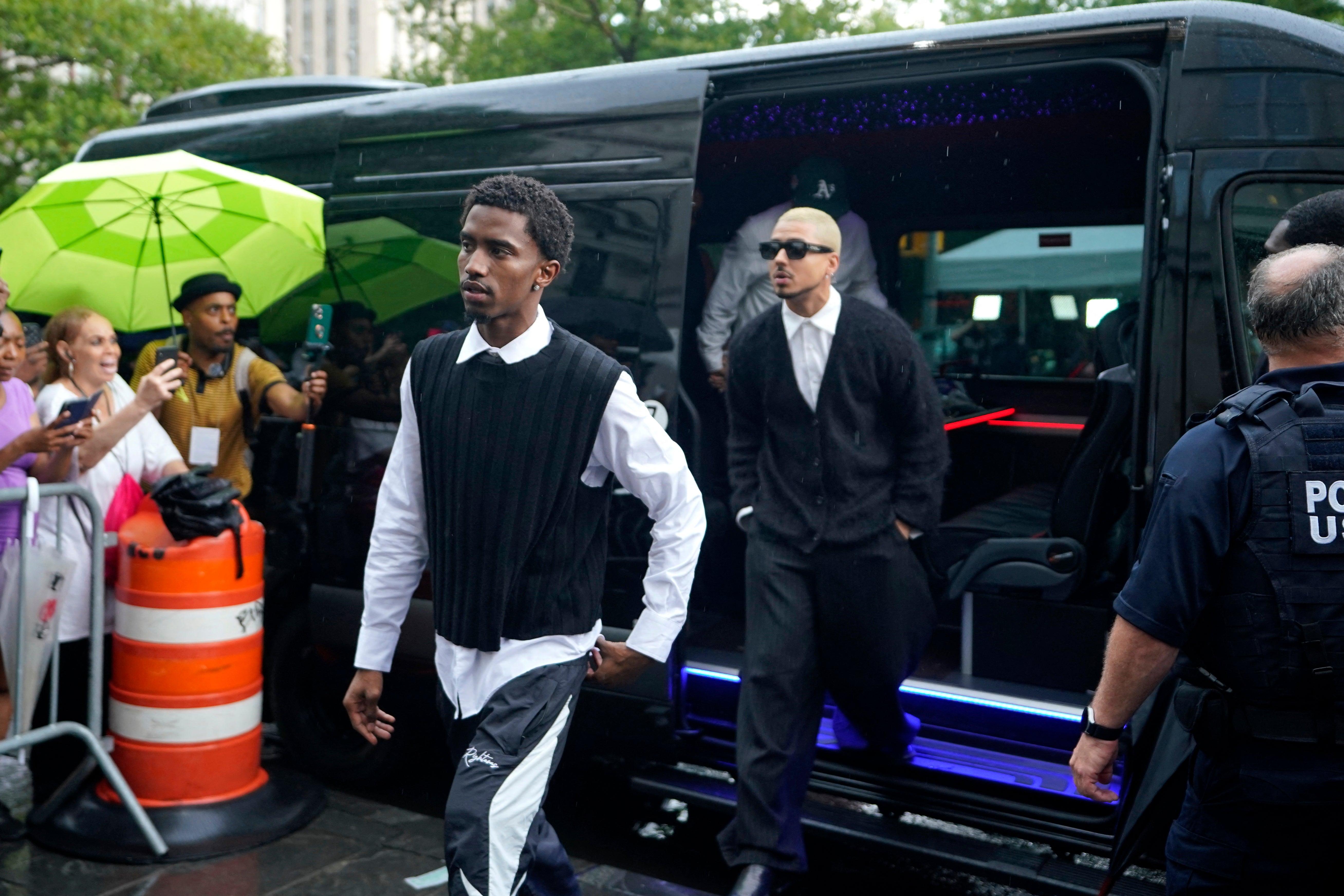 King Combs, left, son of Sean Combs, and Quincy Brown, right, stepson of Combs, outside Manhattan federal court