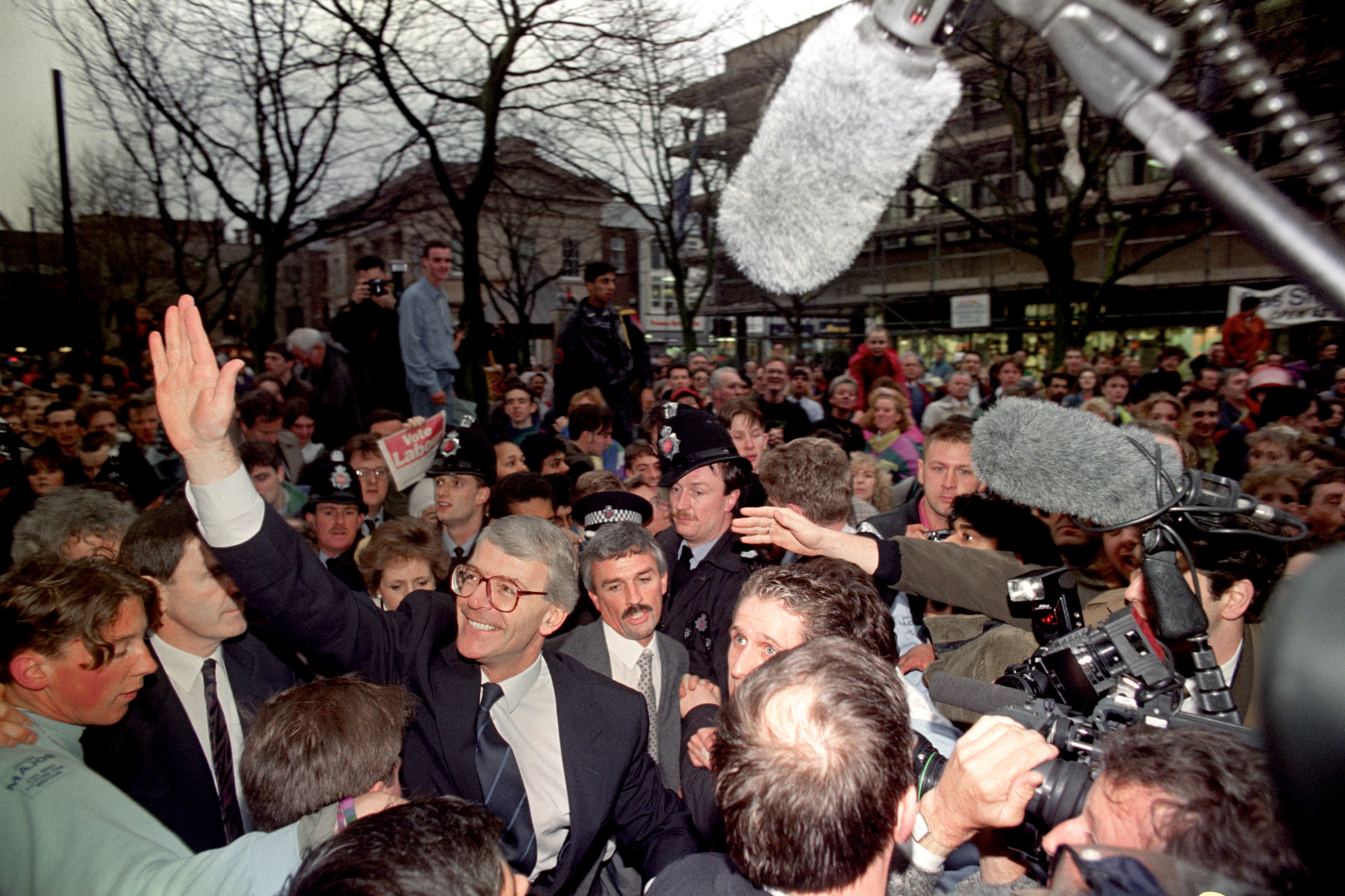 John Major meets people on a walkabout in Bolton during the 1992 general election campaign (Adam Butler/PA)