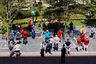 People gather to leave tributes at Anfield Stadium following the death of player Diogo Jota