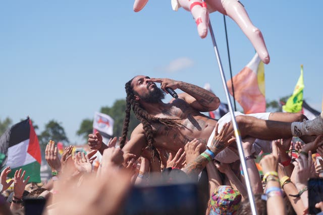 Bob Vylan crowdsurfing during his West Holts Stage set at Glastonbury (Yui Mok/PA)