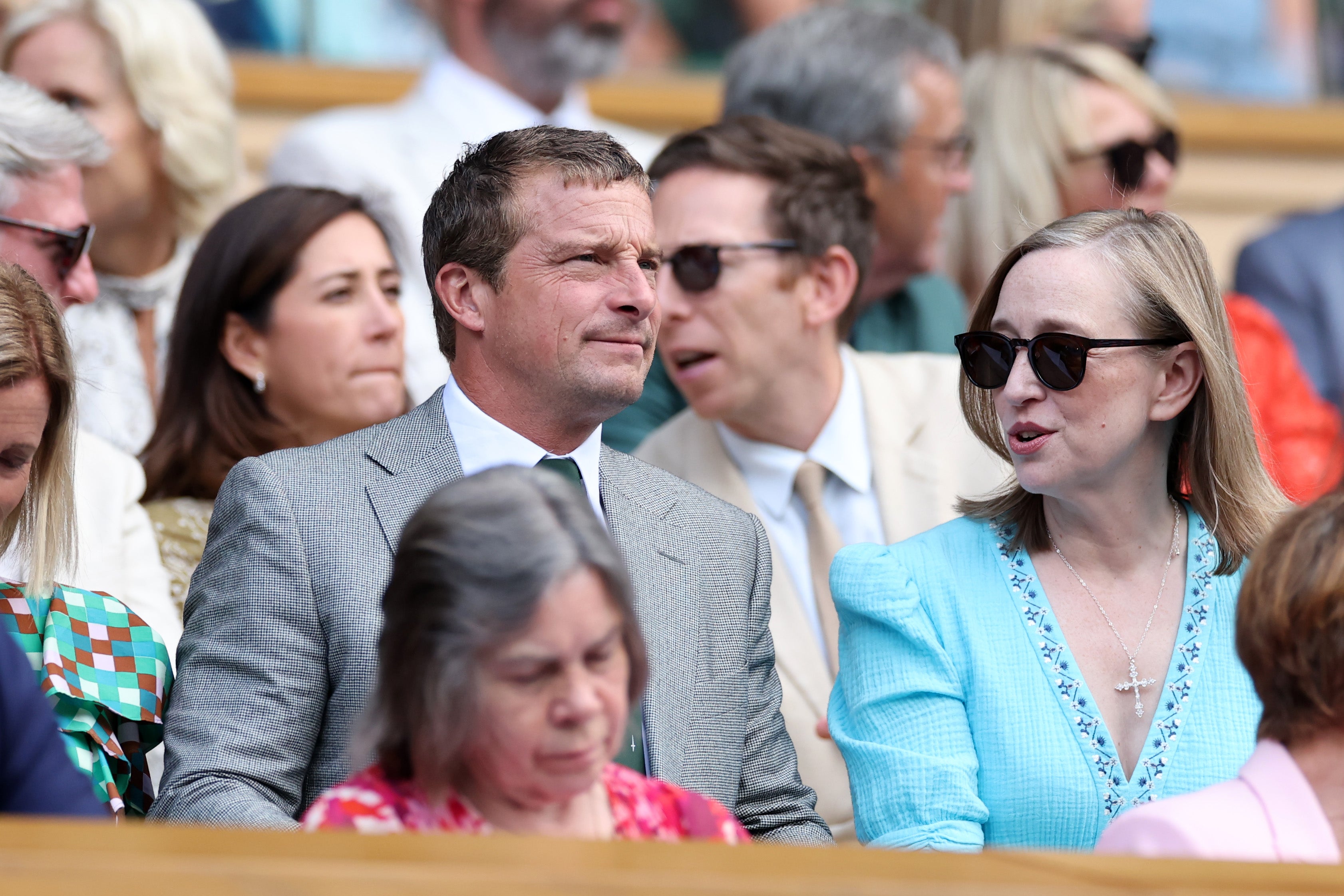 Bear Grylls sits in the stands next to Elizabeth Sharkey, wife of Feargal