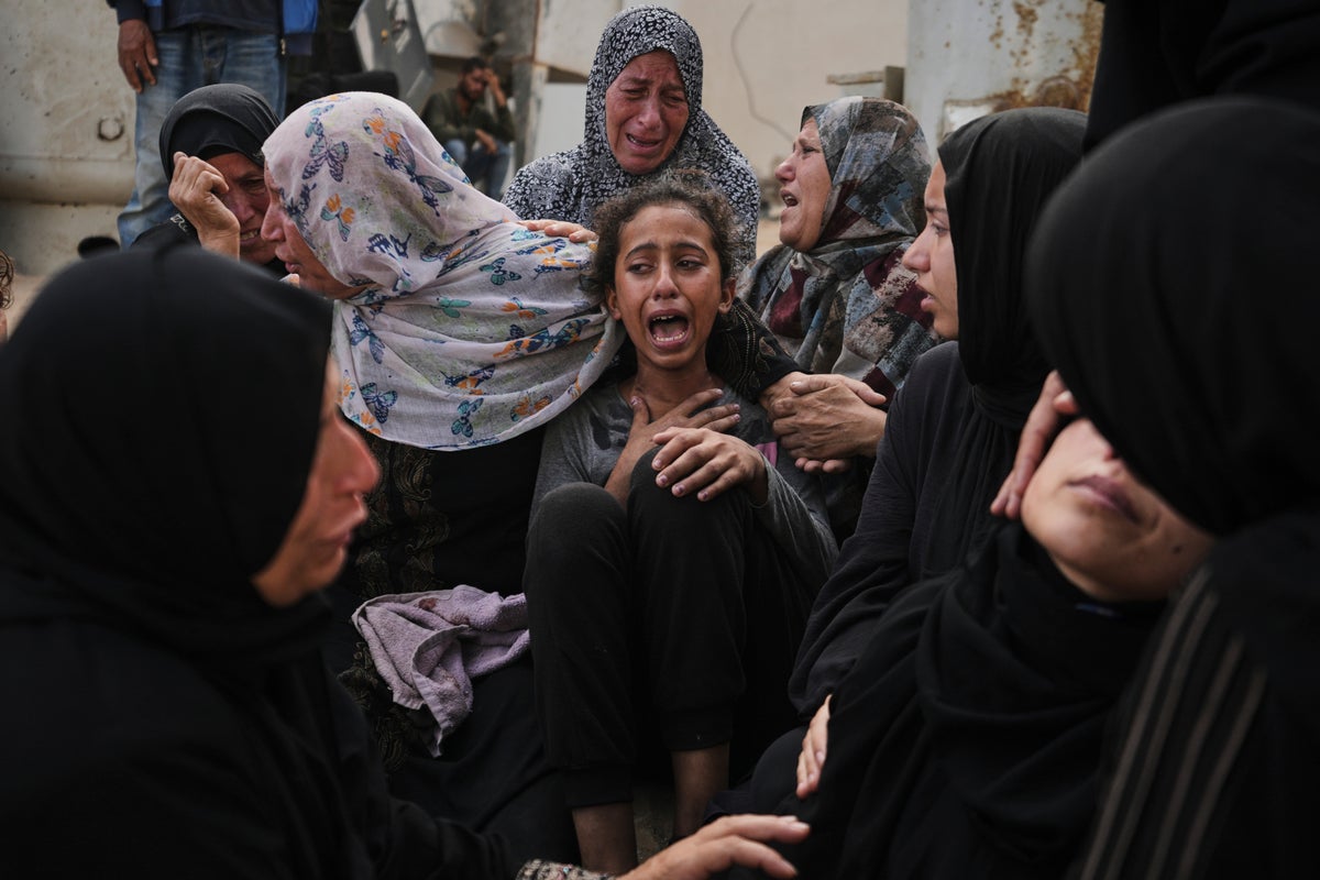 Photos show people mourning after airstrikes and shooting in Gaza overnight