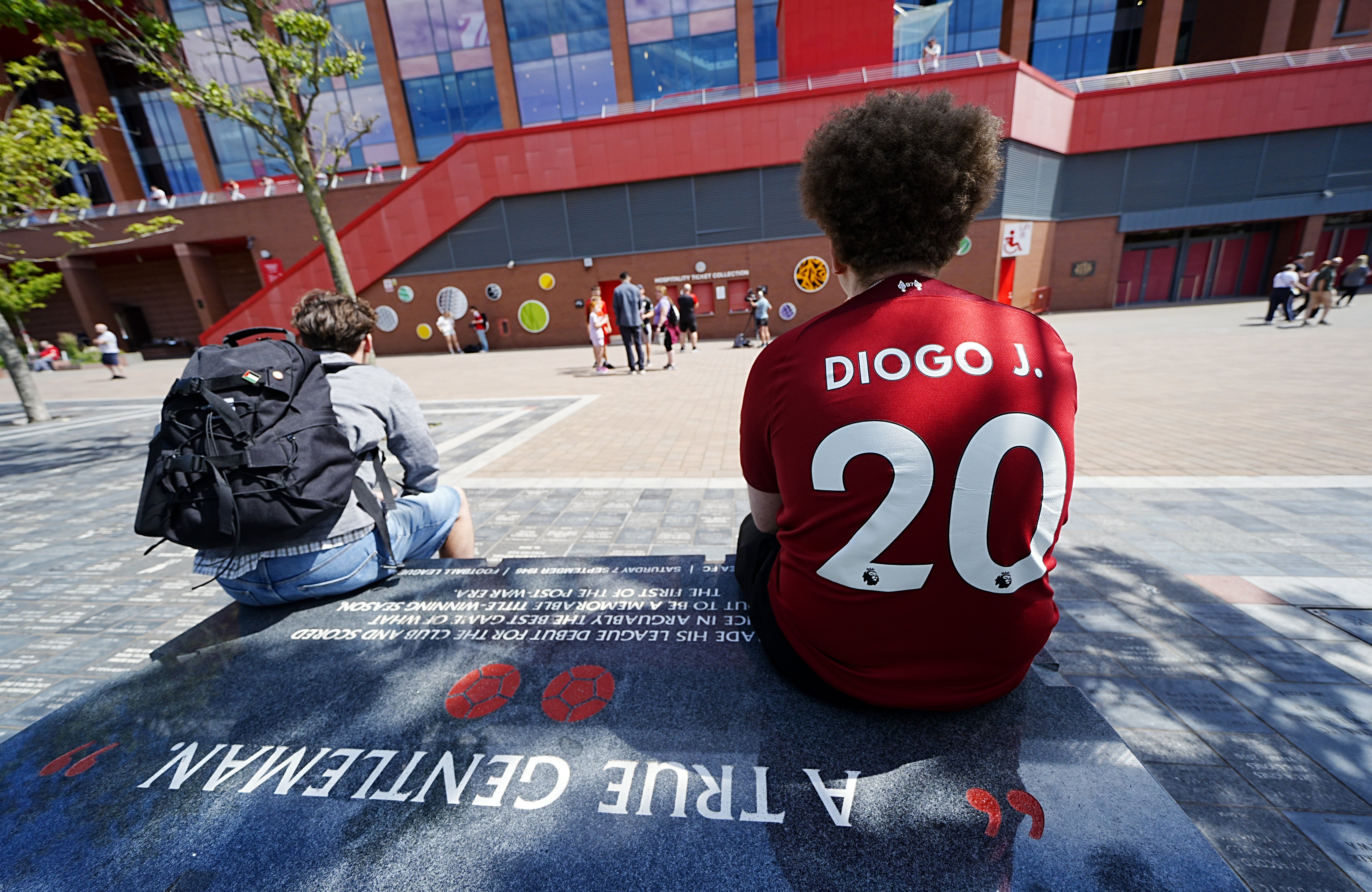 A Liverpool fan at Anfield Stadium, home of Liverpool, after laying a tribute in memory of Diogo Jota who has died at the age of 28 (Peter Byrne/PA)