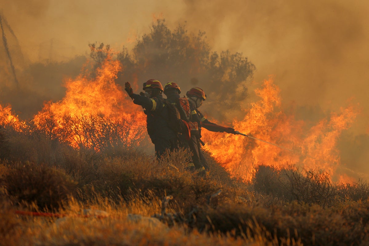 Firefighters race to contain wildfires in Greece as thousands evacuated, elderly man dies in Turkey