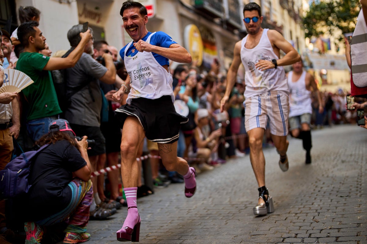 Photos of Madrid's high heel race where runners braved the heat for Pride Week