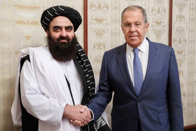 <p>Russian Foreign Minister Sergey Lavrov, right, and Acting Foreign Minister of Afghanistan's Taliban movement Amir Khan Muttaqi pose for a photo prior to their talks in Moscow, Russia</p>