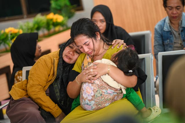 <p>Relatives wait for news on the search operation after a ferry sank off the popular Indonesian resort island of Bali in East Java</p>