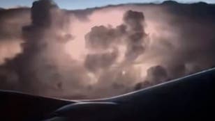 Passengers watch spectacular storm from plane window