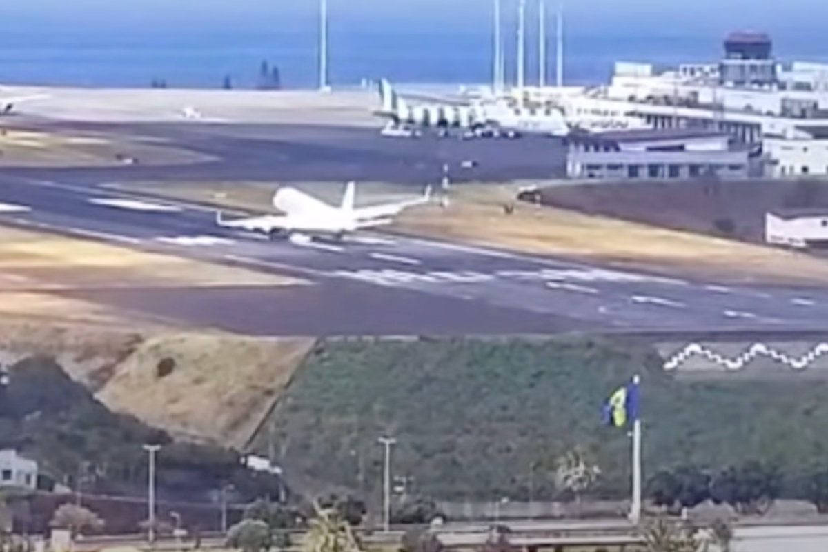 Plane bounces off runway while battling strong winds at popular holiday airport