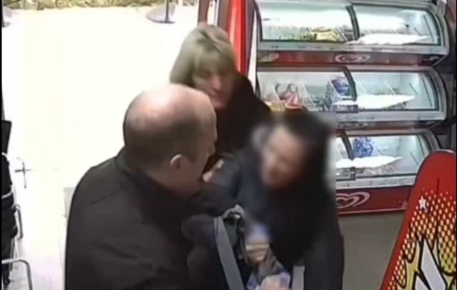 <p>A suspected shoplifter is stopped as she leaves a shop in Durham, a city that has seen a huge increase in offences in recent months</p>