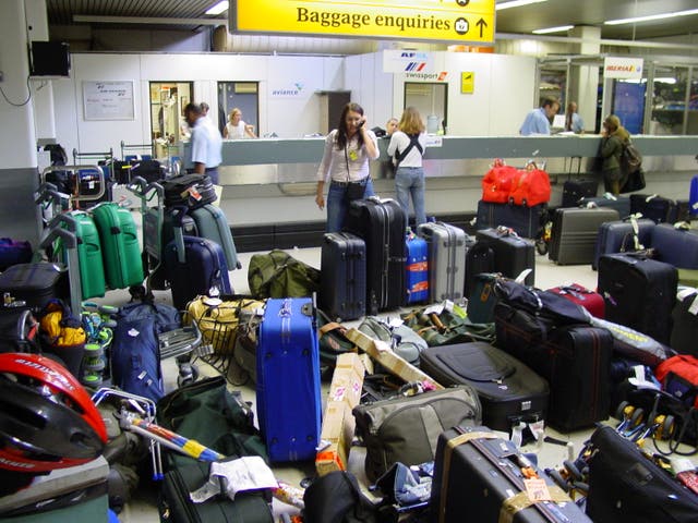 <p>Case load: Misrouted baggage waiting for owners at a UK airport</p>