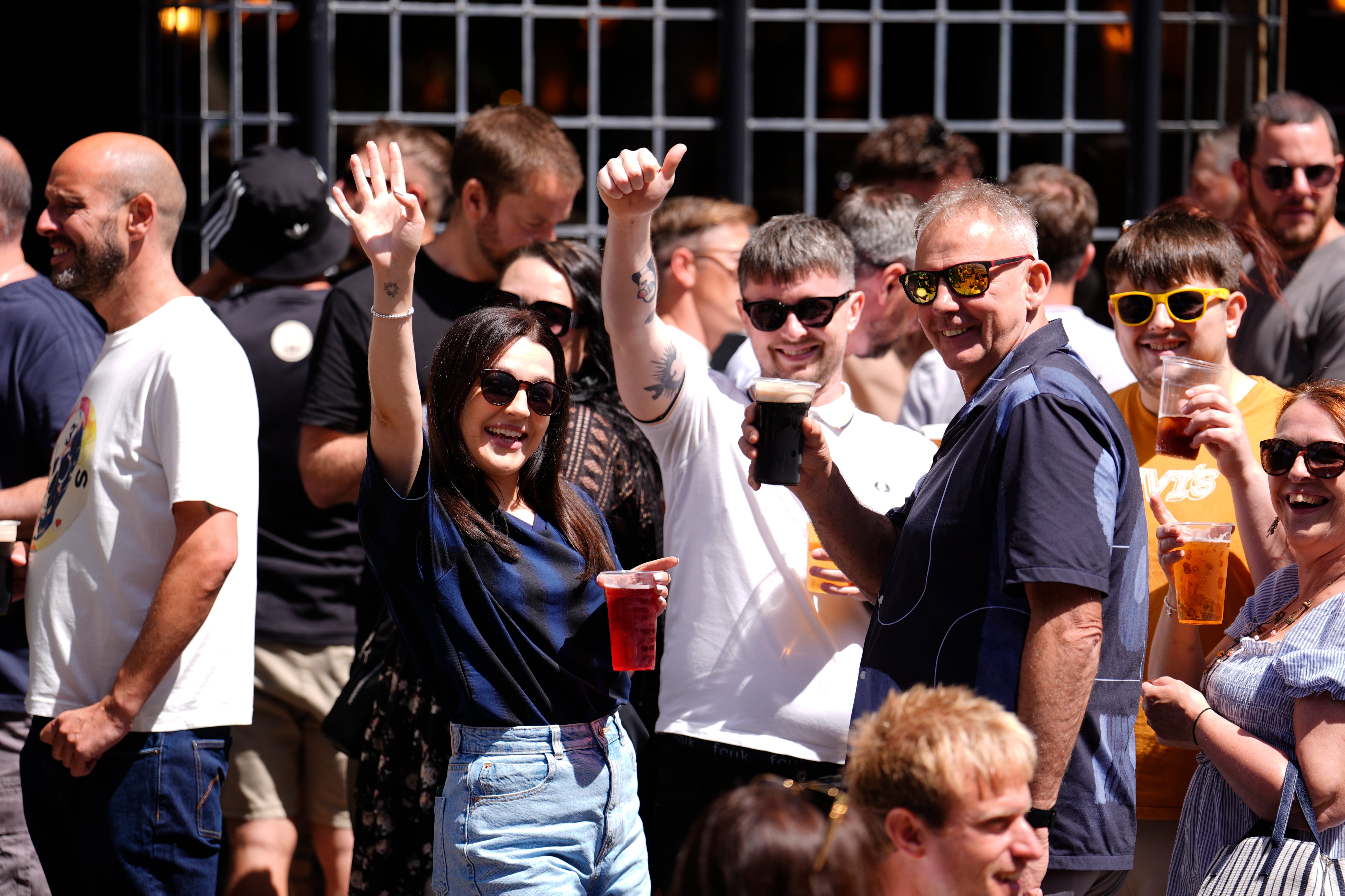 Oasis fans enjoying a drink in the Cardiff sunshine, ahead of the first show in the band's long-awaited reunion tour which kicks off at the Principality Stadium in Cardiff, Wales tonight
