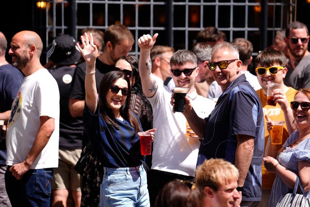 <p>Oasis fans enjoying a drink in the Cardiff sunshine, ahead of the first show in the band's long-awaited reunion tour which kicks off at the Principality Stadium in Cardiff, Wales tonight</p>