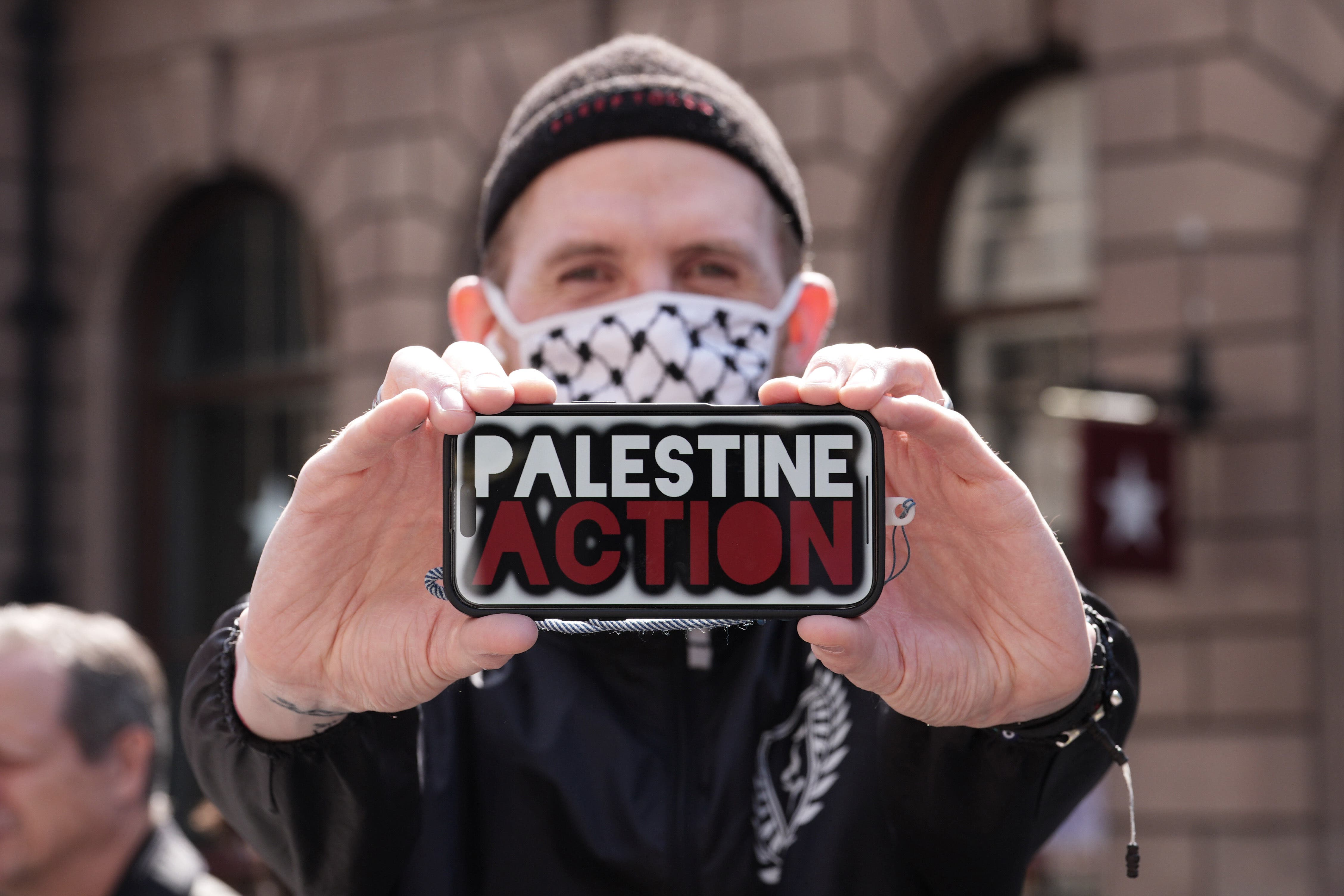 Hundreds gathered on the Strand in support of Palestine Action (Lucy North/PA)