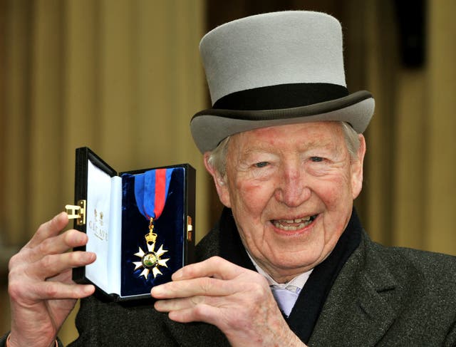 <p>Sandy Gall during the 2011 investiture ceremony at Buckingham Palace</p>