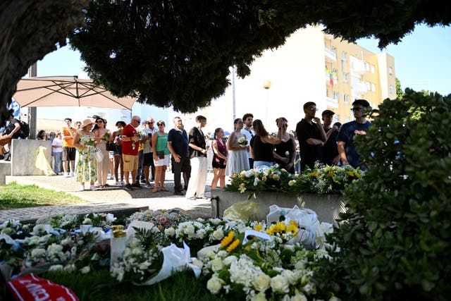 Mourners and floral tributes at the wake of Diogo Jota (PA)