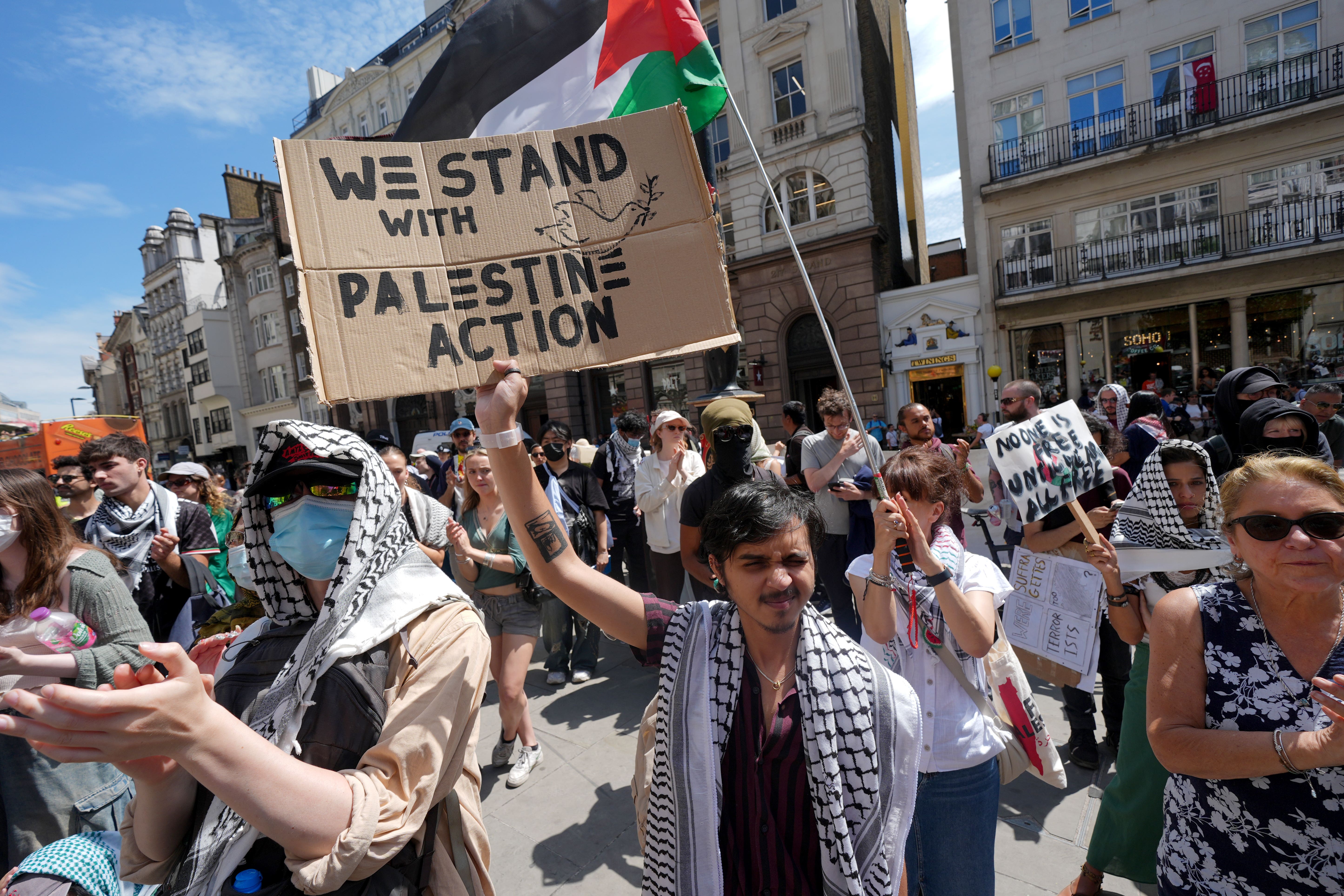 Protesters outside the Royal Courts of Justice (Lucy North/PA)