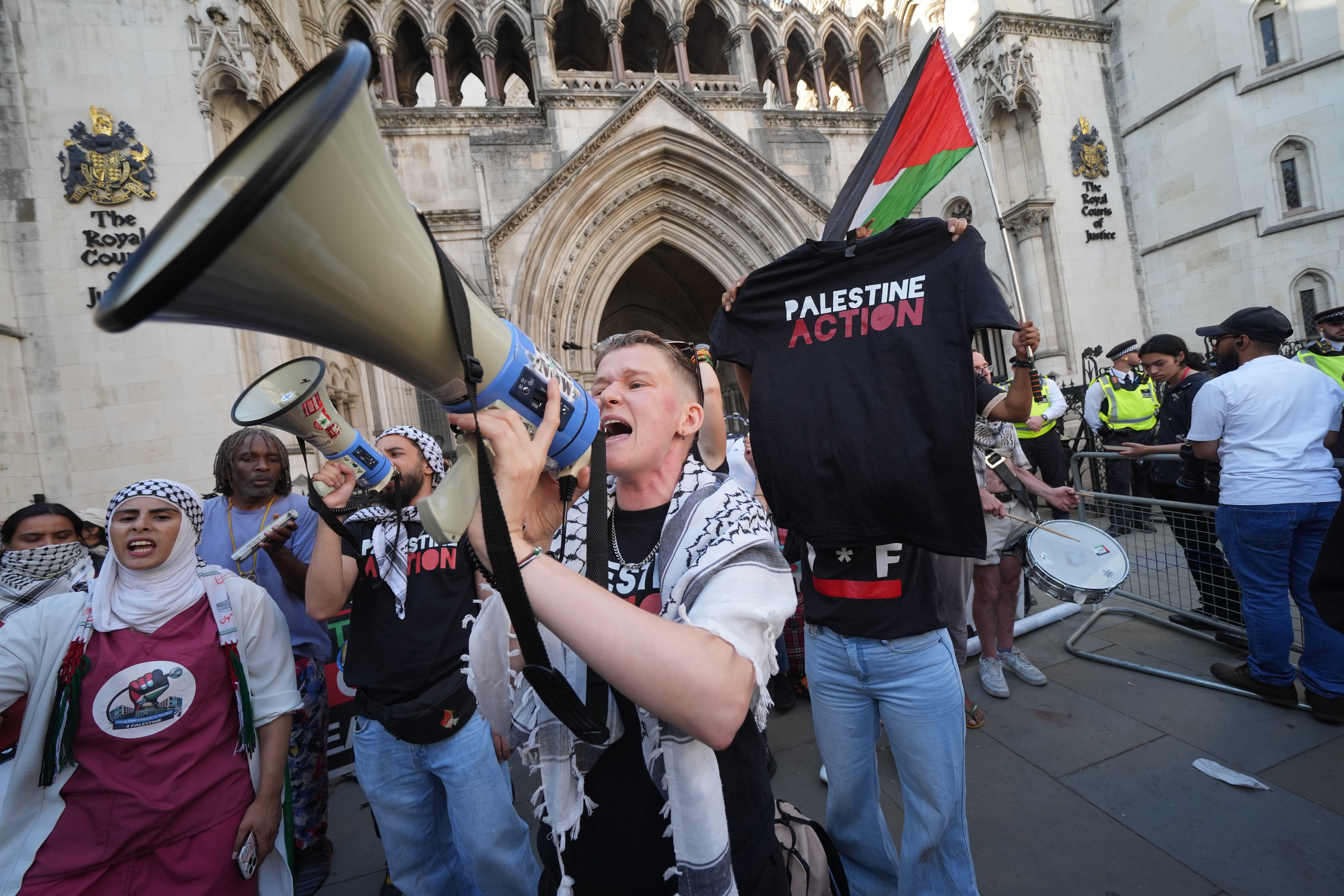 Protesters demonstrated outside the Royal Courts of Justice in central London (PA)
