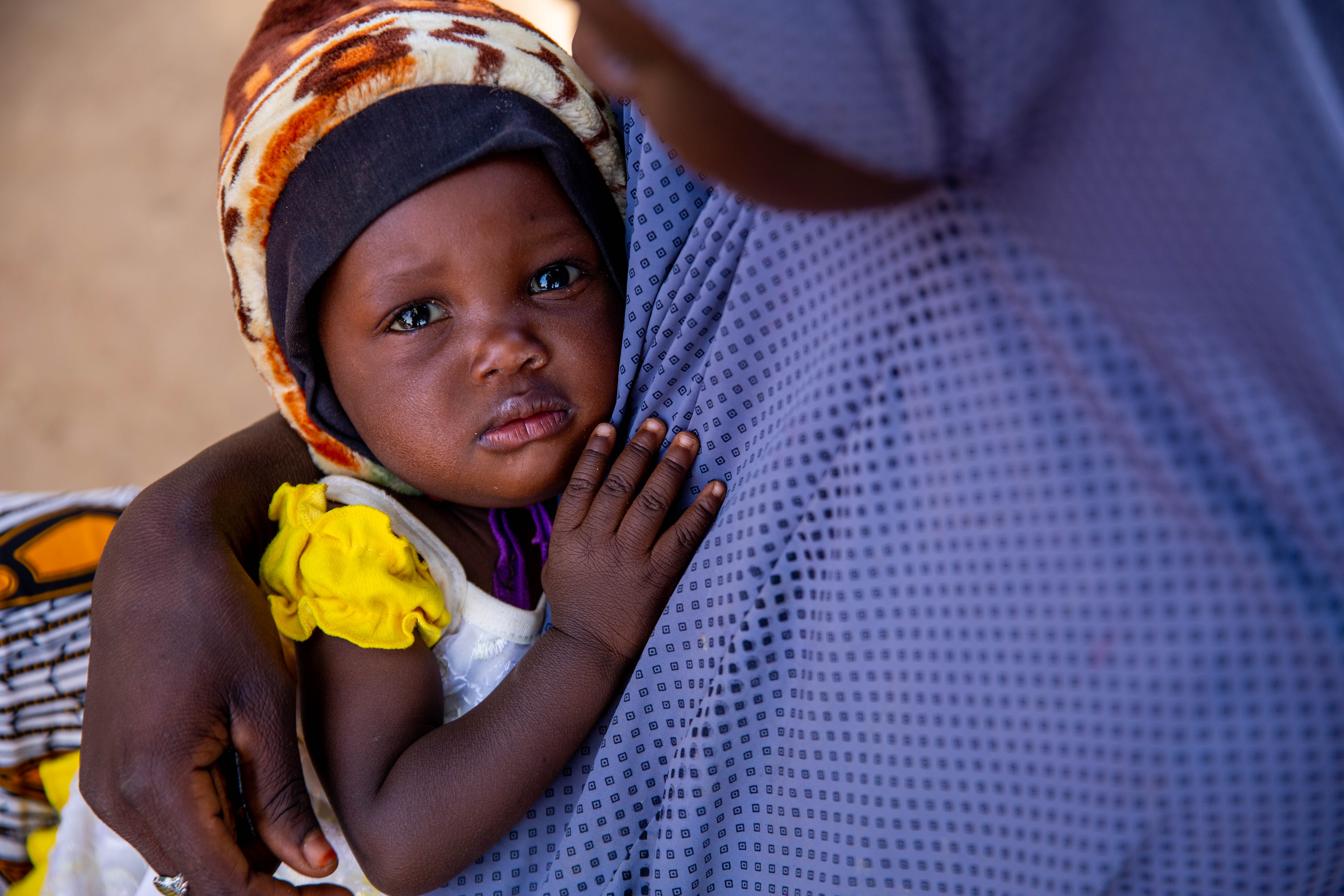 Ya Kaka, 25 holds her baby Binta, who is currently in receipt of malnutrition support from WFP Nigeria