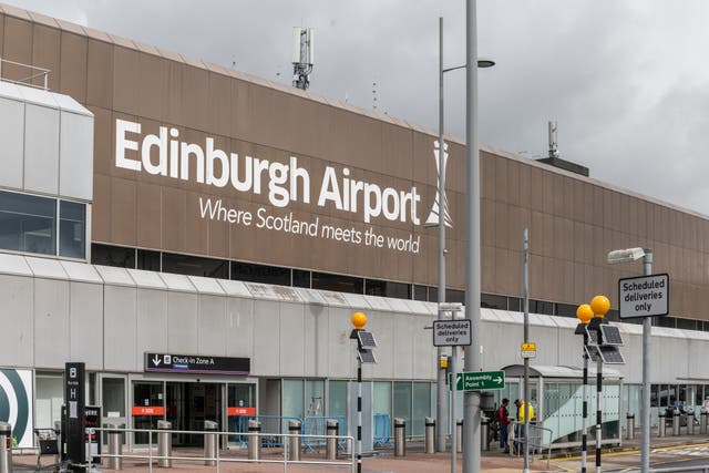 <p>'Where Scotland meets the world': the sign outside Edinburgh Airport, Scotland's busiest airport</p>