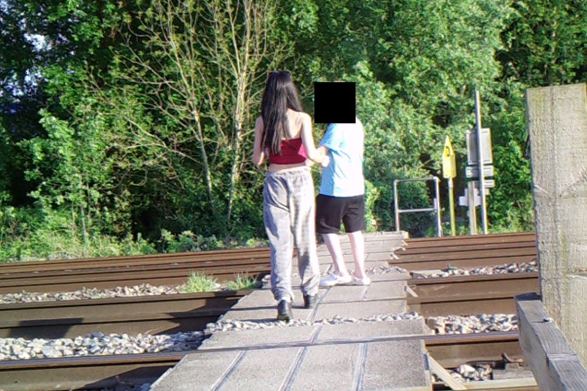 Children dancing and taking selfies on railway line causes closure of crossing