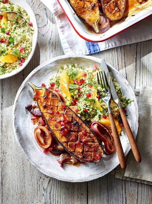 Roasted aubergine with warming spices and citrus, served with herb-studded couscous