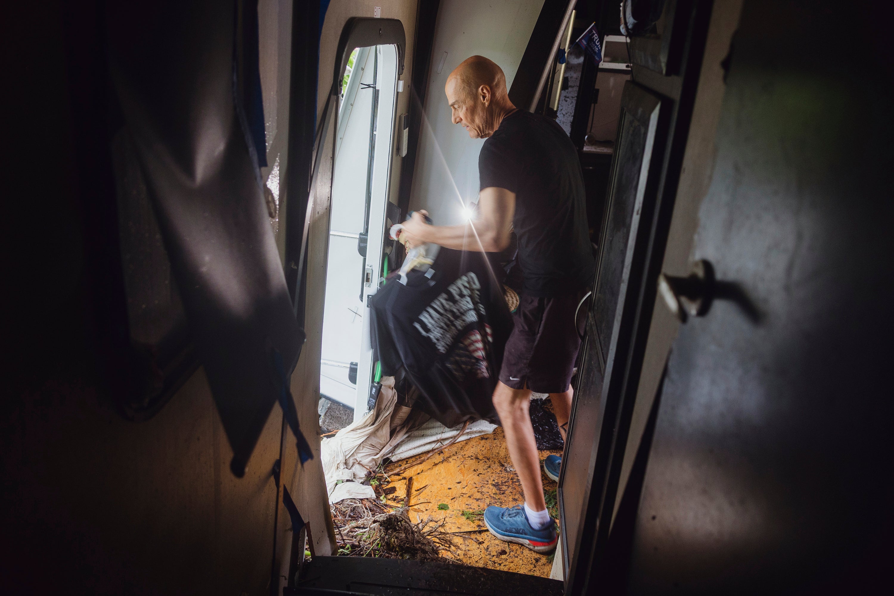 Thomas Rux, a resident of Riverside RV Park, goes through the wreckage of his RV that was swept away by floodwaters in Ingram, Texas, on July 4.