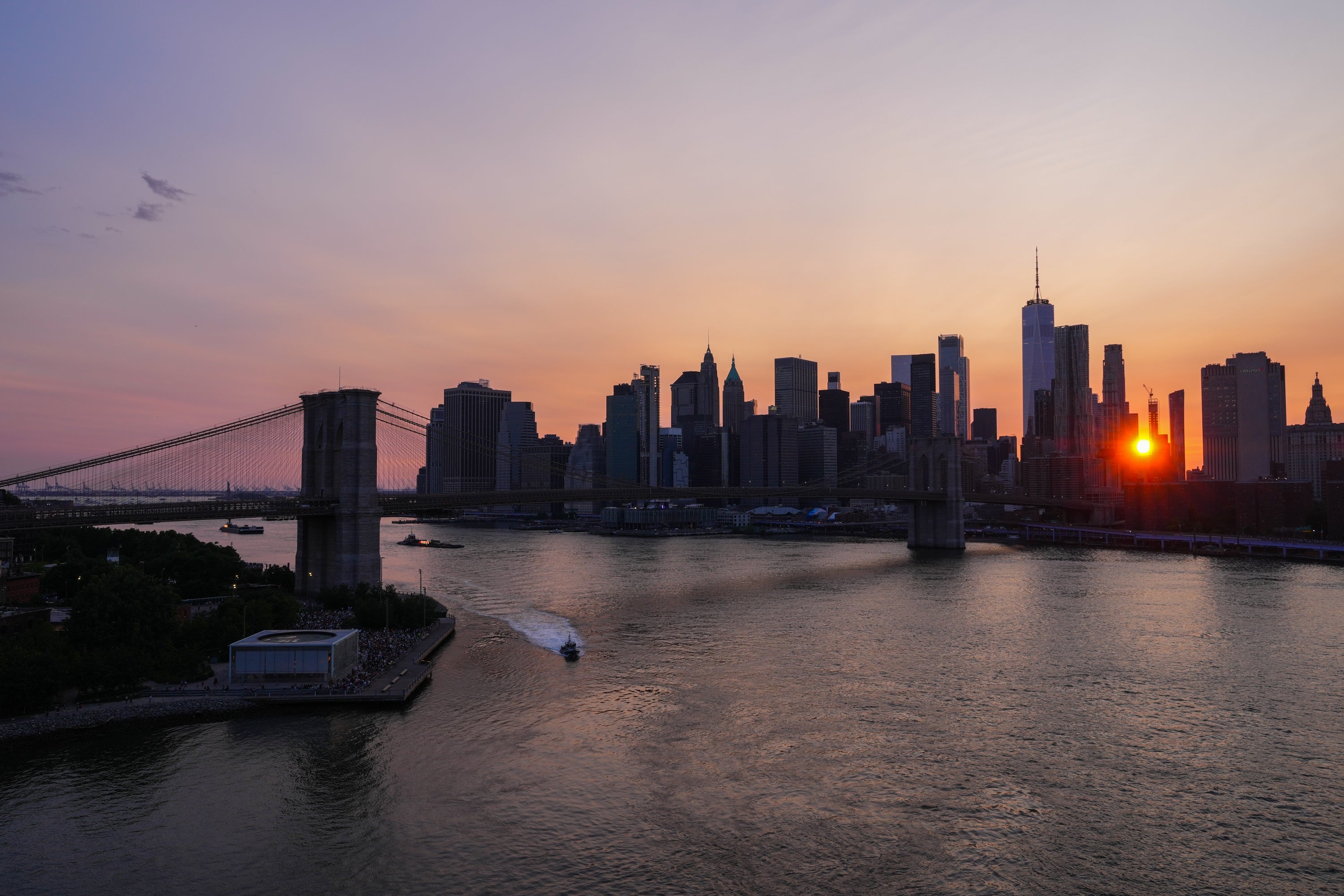 The sun sets over the East River, where the Macy's 4th of July Fireworks show is set to happen
