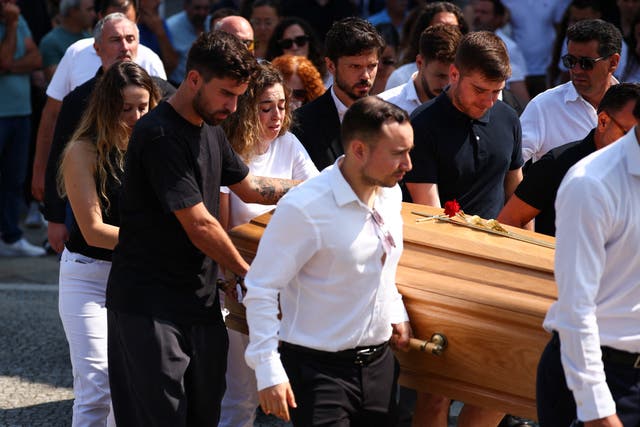 <p>Diogo Jota’s close friend and football star Ruben Neves carries the coffin out of the church alongside Jota’s wife, Rute Cardoso</p>
