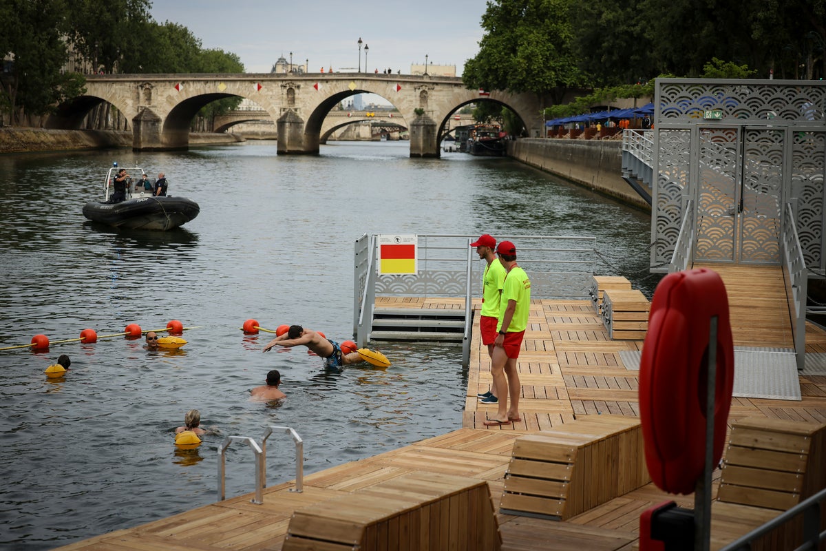 In pictures: Swimmers plunge into the river Seine after 100-year ban lifts