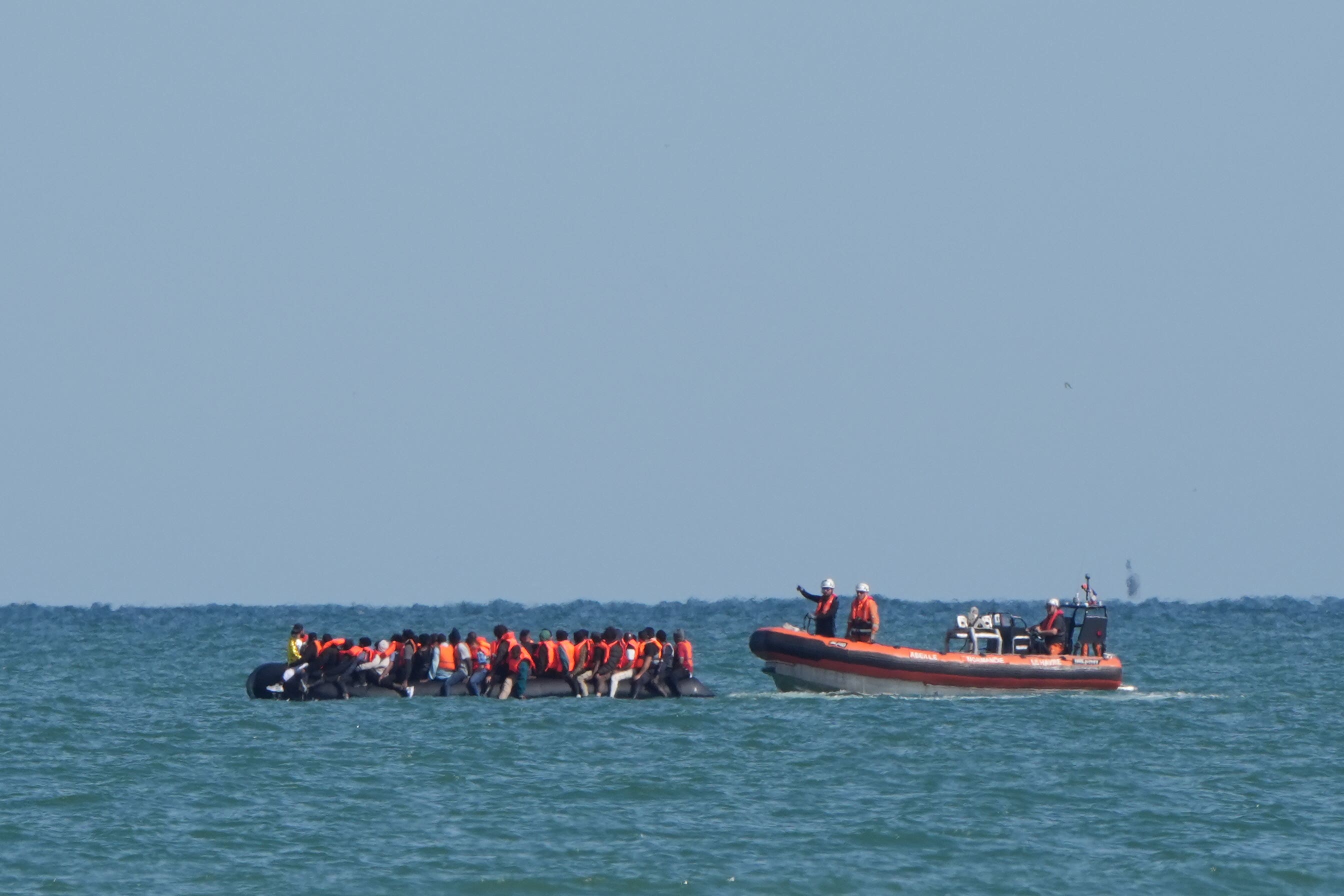 A boat intercepted people thought to be migrants on board a rigid inflatable boat in the English Channel off the coast of Calais (PA)