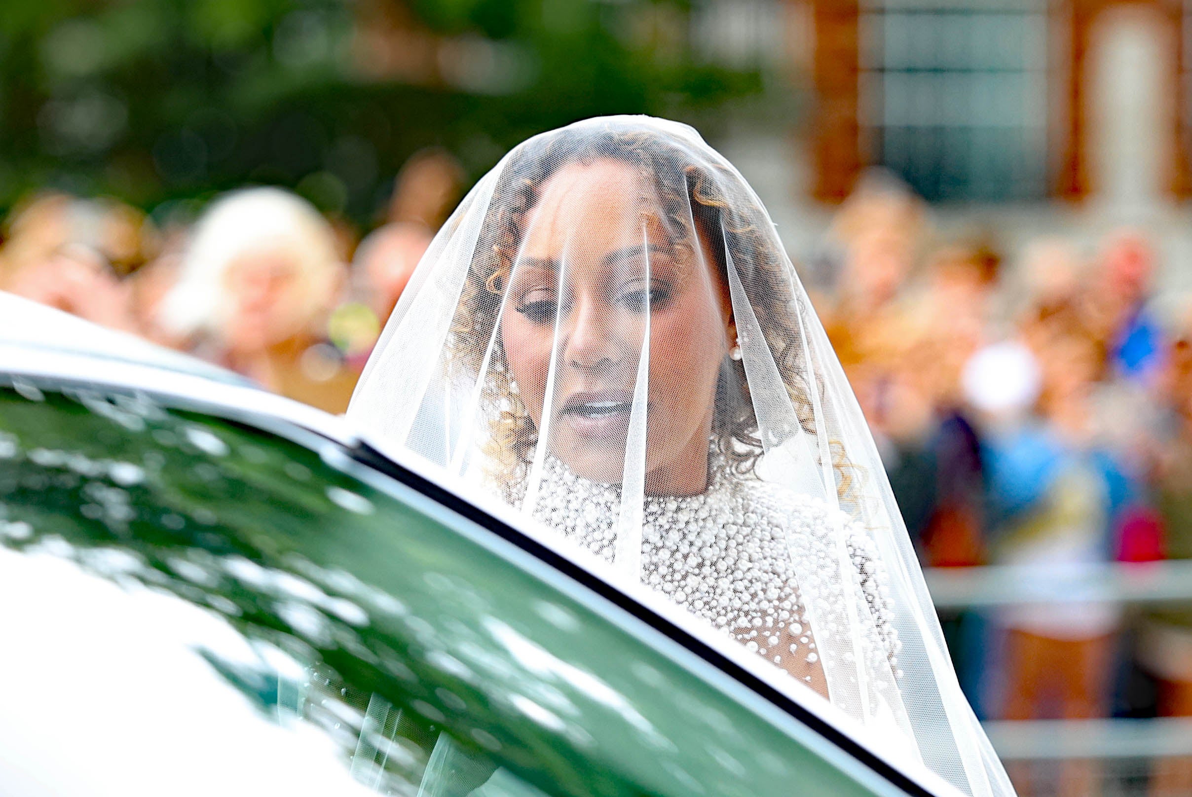 Melanie Brown arrives in a dramatic white dress to marry Rory McPhee