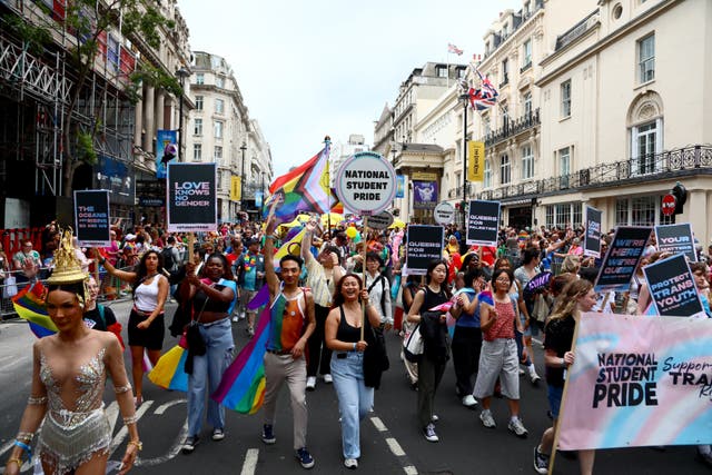 <p>The Pride march proceeds through central London yesterday</p>