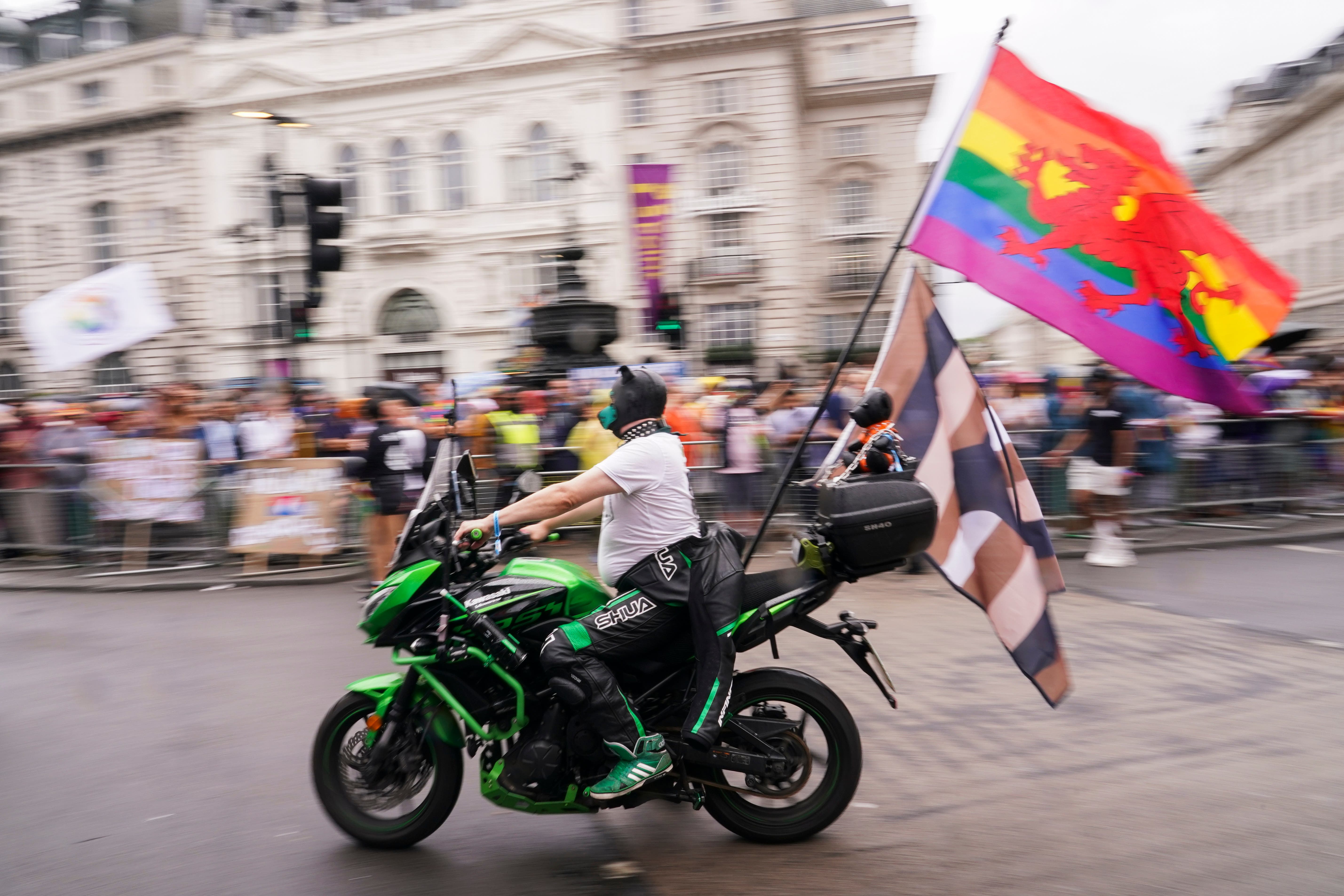 A motorcyclist attends the Pride in London 2025 parade, in London (Alberto Pezzali/AP)