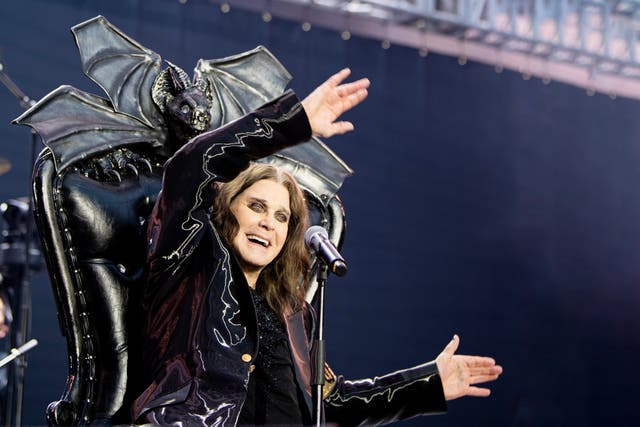 <p>Ozzy Osbourne waves his arms as his plays his final show</p>