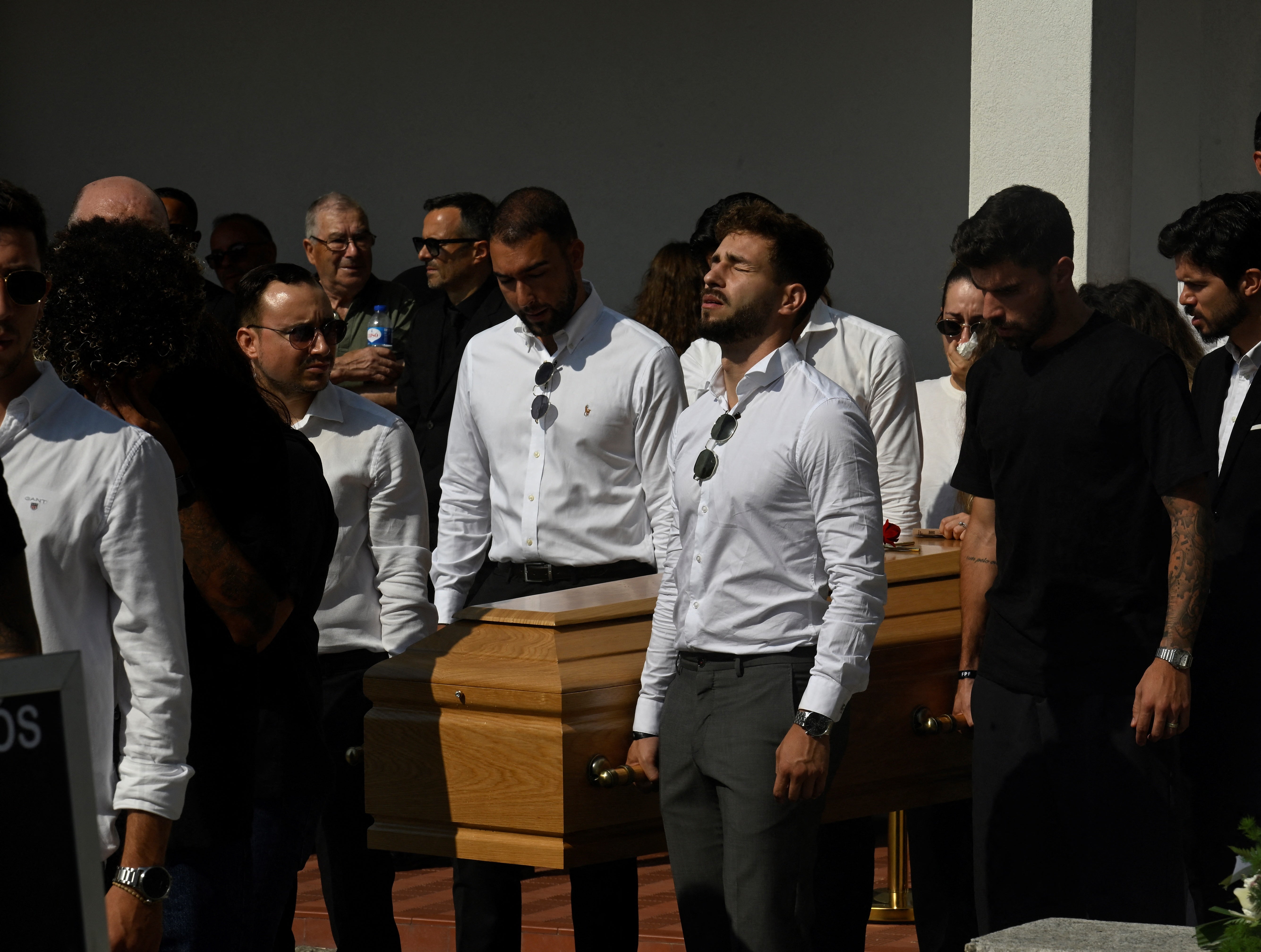 Former teammates carry the coffin during the funeral of Liverpool's Portuguese striker Diogo Jote and his brother Andrea Silve in the mother's church of Gondomar, on the outskirts of Porto