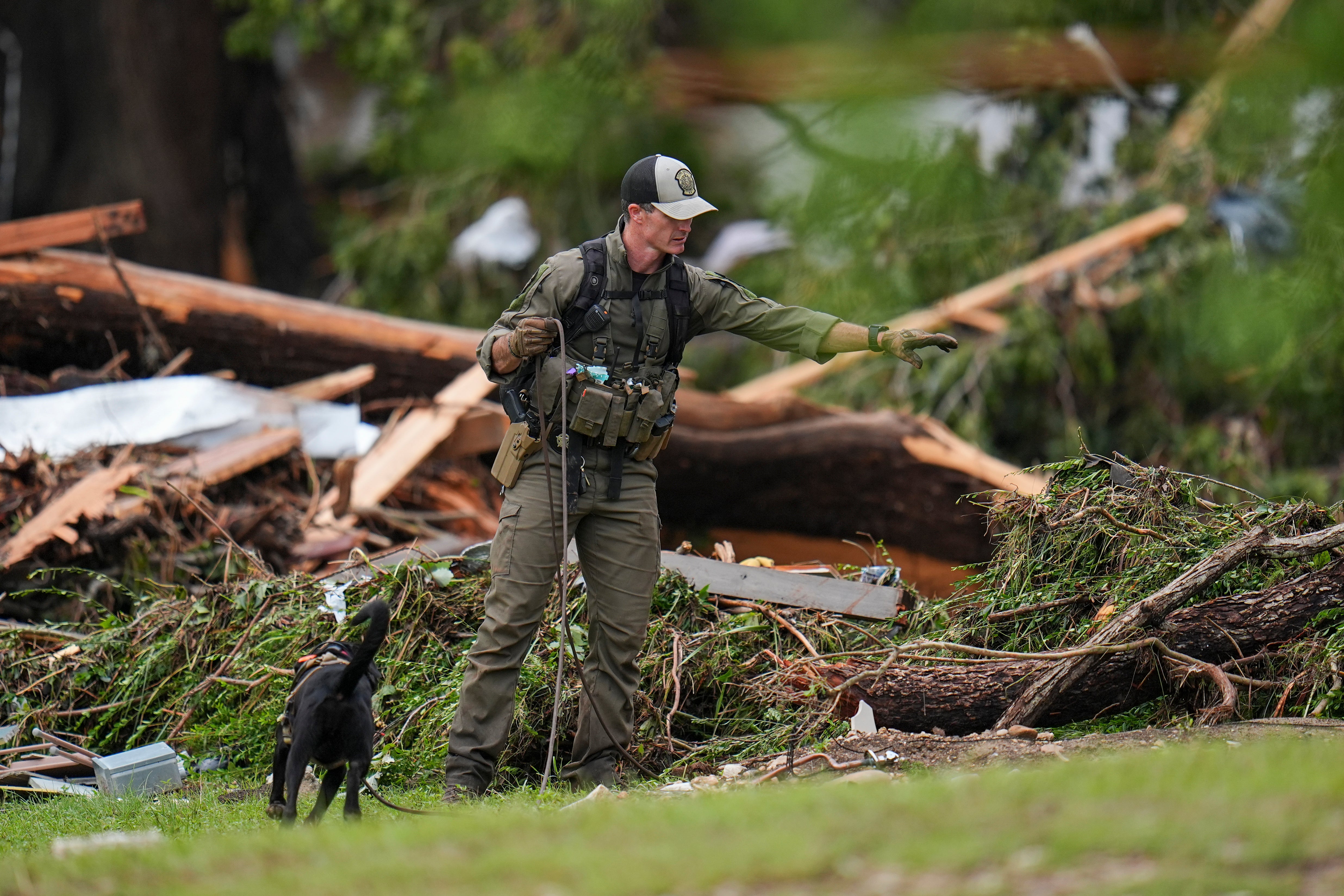 Officials comb areas hit by flooding in search of victims