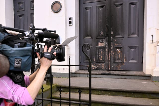 <p>A camera crew film the burnt front entrance of the East Melbourne Synagogue in Melbourne</p>