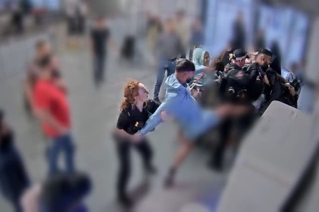 <p>CCTV still of the alleged assault of three police officers at Manchester Airport (Crown Prosecution Service/PA)</p>