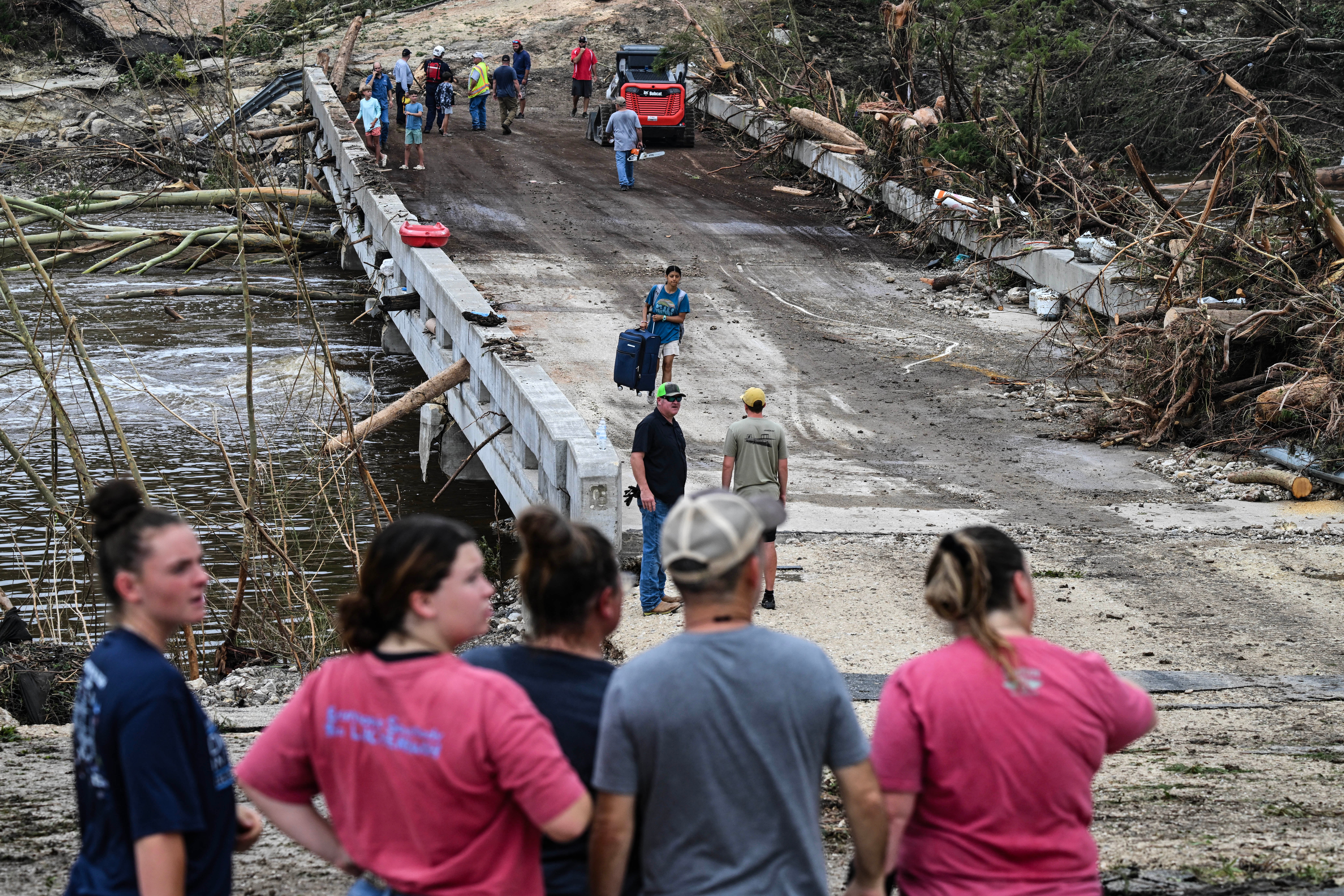 Law enforcement and volunteers continue to search for missing people near Camp Mystic. Officials said 27 people, including campers and counselors, were killed at the Christian girls’ camp