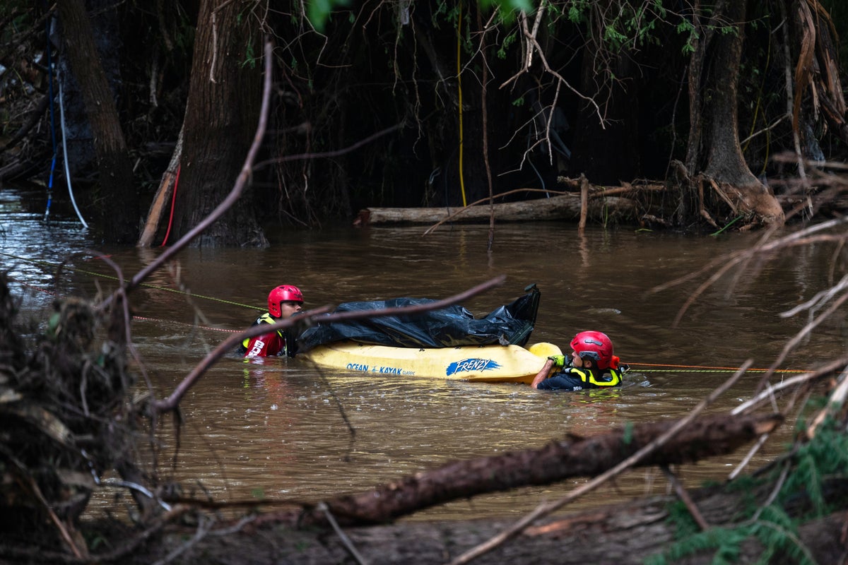 Photos of search crews racing against time as Texas flood deaths near 90