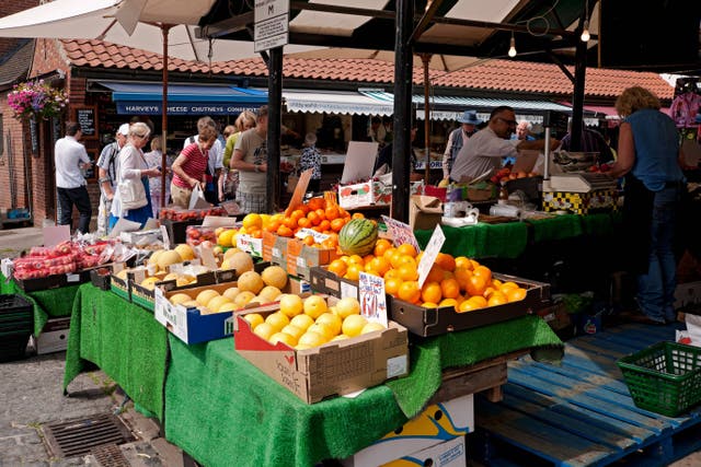 Fresh fruit for sale at an outdoor market stall in North Yorkshire (Alamy/PA)