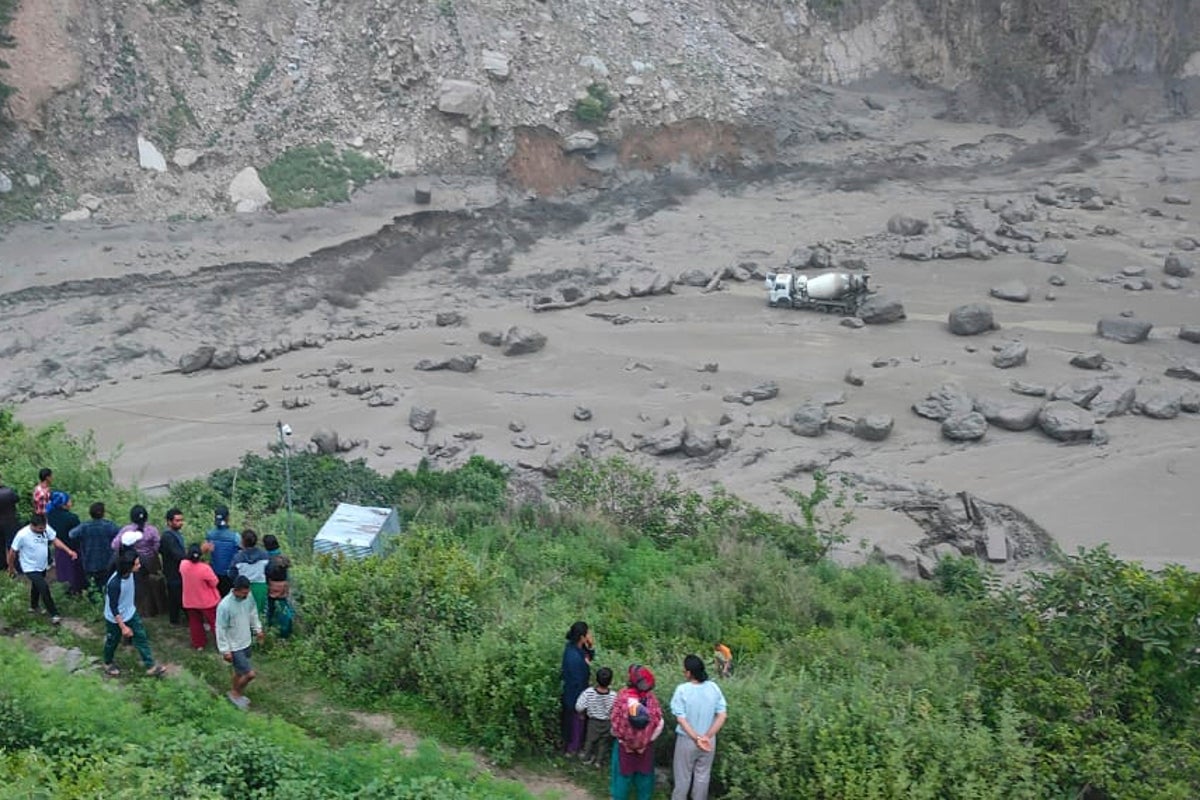 Monsoon floods sweep away 18 people and the main bridge linking Nepal to China