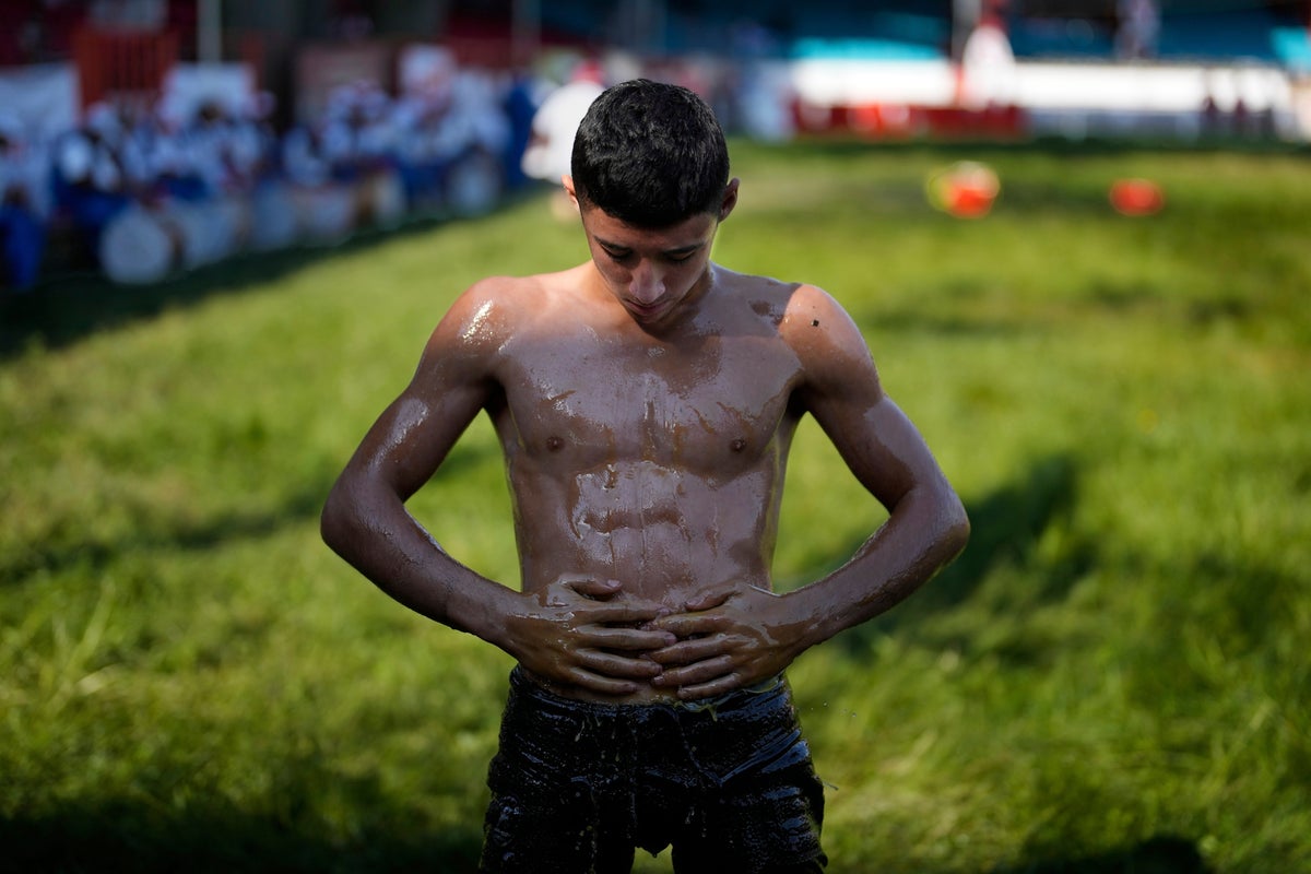 Photos show Turkey's youngest oil wrestlers keeping a 14th-century tradition alive